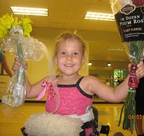 Madi recieves flowers after dancing in her dynamic stander
