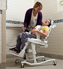 The Rifton HTS shown as a chair that can transfer from the toilet to the shower. 