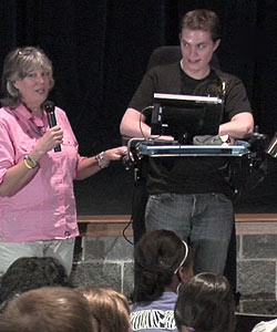 Sean Carter and his mother in an auditorium, speaking to students about his accident and the lessons he learned.