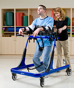 Adaptive+Devices+For+Quadriplegia young man with developmental disabilities is assisted by a therapist ...