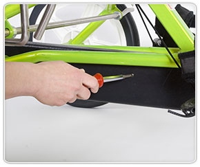 Removing the adaptive special needs trike chain guard screw