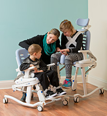 The Rifton HTS adapts to a childs size with adjustable features as shown with children that are several years apart in age.