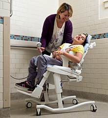 The Rifton HTS shown as a chair that can transfer from the toilet to the shower.