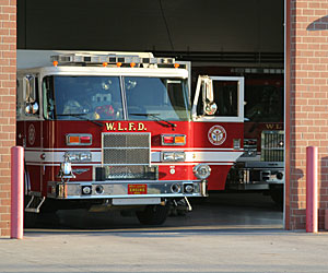 A fire truck in the station illustrates the setting in which Tony Tumminello, a man with disabilities, shared his story with firefighter friends 
