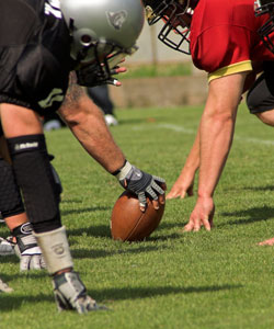 Football players help students with special needs