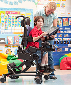 A child with extensor tone is positioned for dynamic seating in the Rifton Activity chair