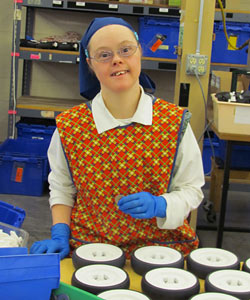 A Rifton worker smiling for the camera