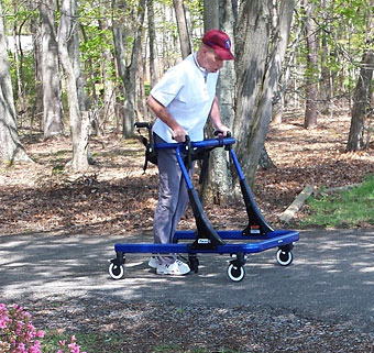 Jimmie Childress in a Rifton Pacer doing gait training at home.
