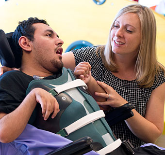 A man with developmental disabilities communicates with his caregiver