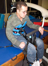 A TBI patient being transferred using the SoloLift and TRAM devices.