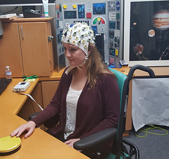 A girl sits in the activity chair for neurodevelopmental disorders therapy studies
