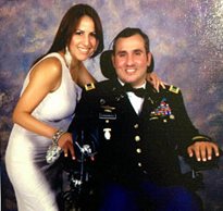 Romy Camargo decorated Army veteran and SCI patient poses for a photo with his wife at a fundraising event for his Stay in Step facility