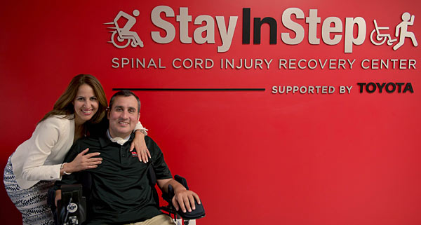 Romy Camargo decorated Army veteran and SCI patient poses for a photo with his wife at his Stay in Step facility