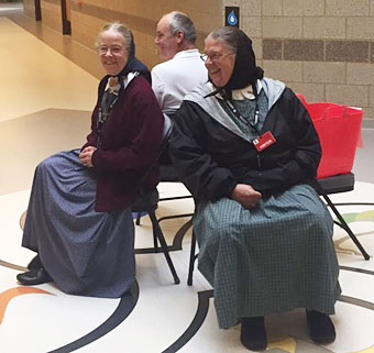 Three Rifton members awaiting a special thank you from a group of students with special needs at Laremont School in Chicago