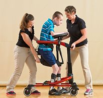 Two therapists using safe patient handling equipment safely and easily assist a student while gait training. 