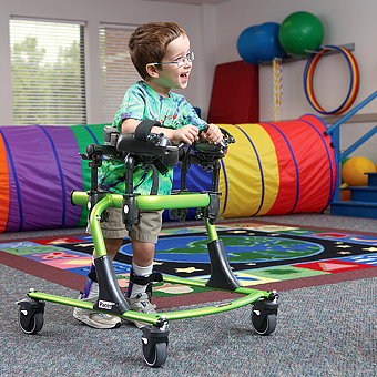 A pink Rifton Pacer pediatric gait trainer showing all prompt accessories