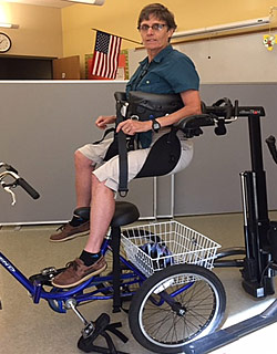 Using the Rifton TRAM to transfer a student over a special needs trike