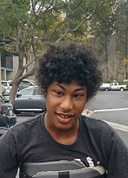 Portrait of Payton in his over ground gait trainer