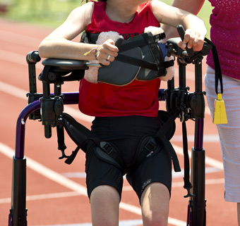 A person using the Rifton Pacer gait trainer with incorrect arm positioning