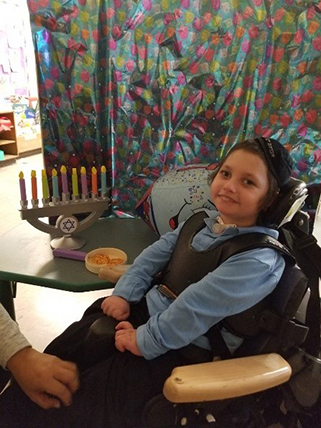 Yaacov before using the Rifton Activity Chair pelvic harness