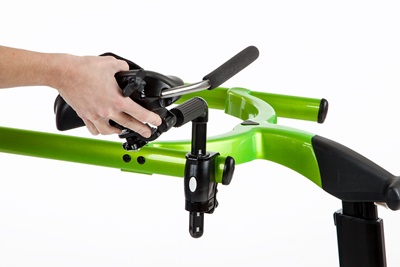 A close up of a hand putting the arm support on a Rifton Pacer gait trainer.