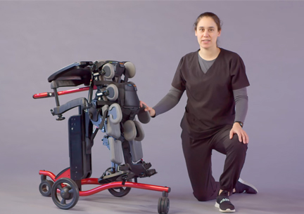 A therapist demonstrating use of a Size 2 Rifton Stander