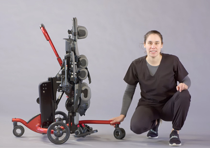 A therapist demonstrating use of a Size 2 Rifton Stander