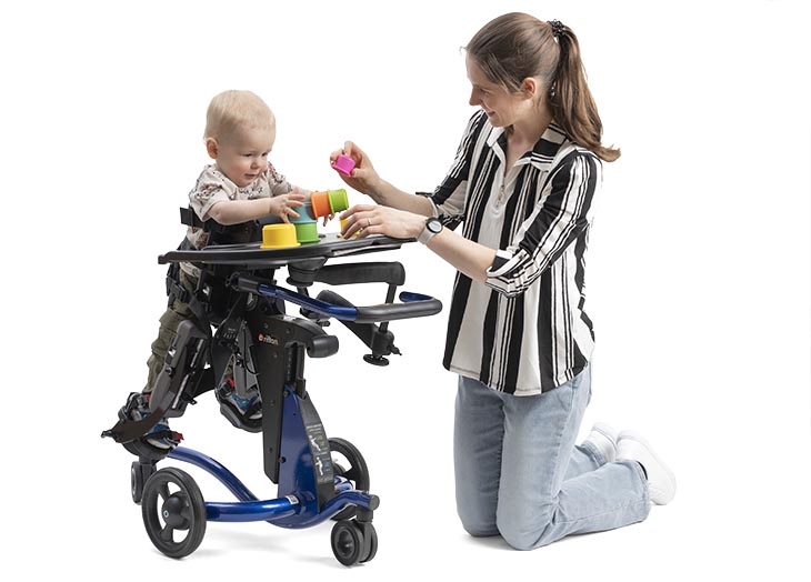 Child in Prone Stander with Caregiver