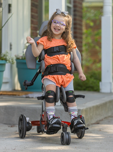 A child in a Size 1 Rifton Stander in supine configuration.