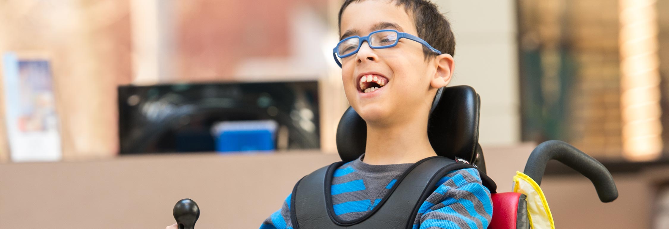 A boy holds onto a Rifton anchor