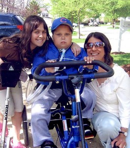 a boy in a Rifton Adaptive Tricycle