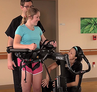 Woman standing in the Rifton E-Pacer