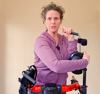 Cathy Ripmaster, PT, demonstrating how to adjust the arm prompts on the Rifton Pacer gait trainer
